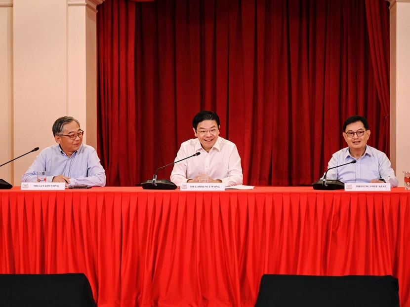 Prime Minister-designate Lawrence Wong (centre), flanked by his chosen deputies Gan Kim Yong (left) and Heng Swee Keat, at a press conference to announce his new Cabinet line-up on May 13, 2024. Prime Minister-designate Lawrence Wong (centre), flanked by his chosen deputies Gan Kim Yong (left) and Heng Swee Keat, at a press conference to announce his new Cabinet line-up on May 13, 2024.