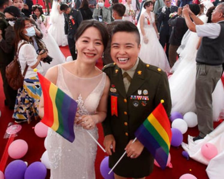 Two same-sex couples in military marry in first for Taiwan
