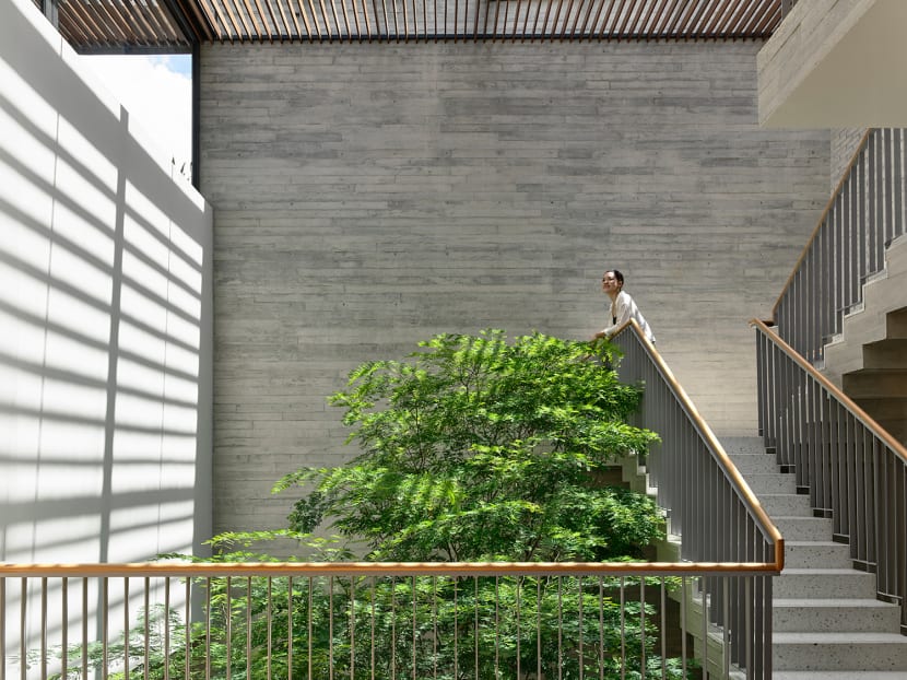 Family life in this bungalow in Singapore revolves around a lush garden in the centre