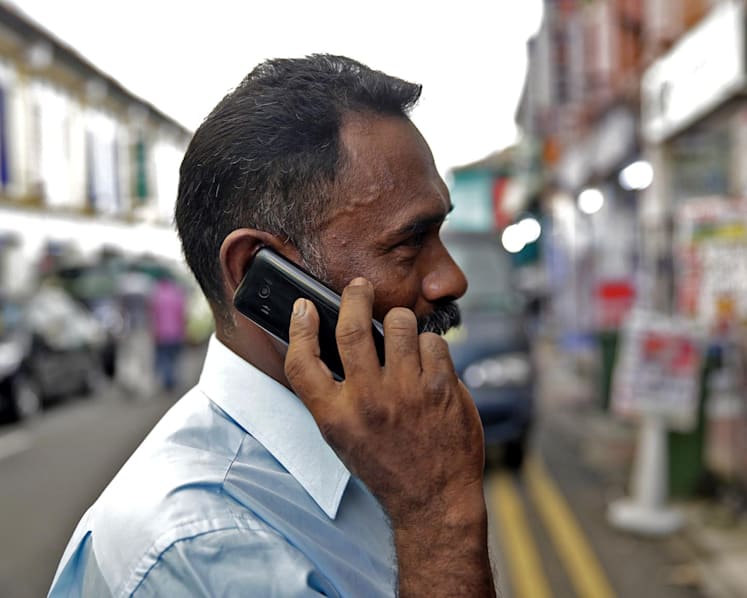 Photographers, organisations answer call to help migrant workers move from 2G to 3G