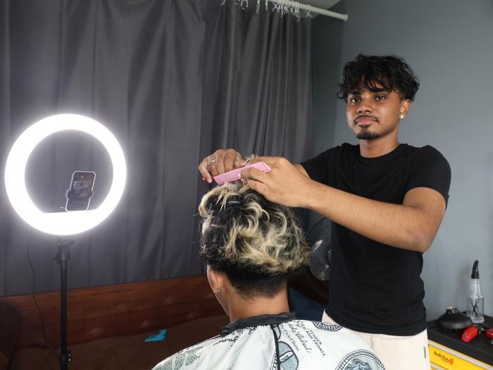 He gave free haircuts for 6 months outside his flat, now this 17-year-old barber has paying clients from all over S'pore