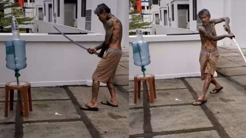 Man who posted video of himself slicing bottle with samurai sword charged