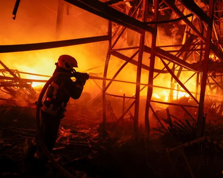 Russian missiles strike Kyiv districts, killing two, officials say