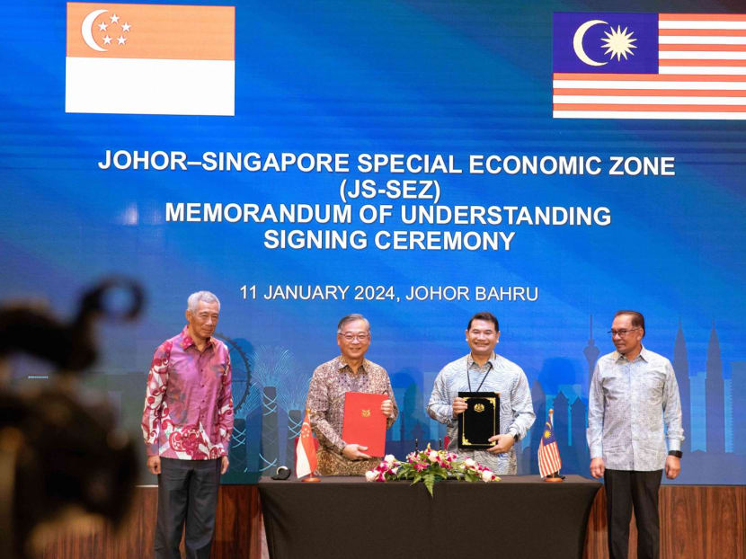 (From left) Singapore's Prime Minister Lee Hsien Loong, Singapore's Trade and Industry Minister Gan Kim Yong, Malaysia's Economy Minister Rafizi Ramli and Malaysia's Prime Minister Anwar Ibrahim at the signing of a Memorandum of Understanding on the Johor-Singapore Special Economic Zone on Jan 11, 2024. (From left) Singapore's Prime Minister Lee Hsien Loong, Singapore's Trade and Industry Minister Gan Kim Yong, Malaysia's Economy Minister Rafizi Ramli and Malaysia's Prime Minister Anwar Ibrahim at the signing of a Memorandum of Understanding on the Johor-Singapore Special Economic Zone on Jan 11, 2024.