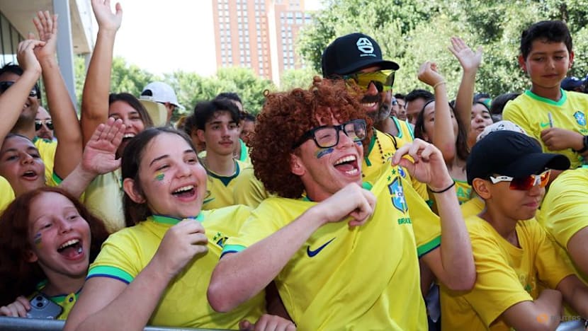 Heat no problem for passionate Brazil fans waiting to greet team in Houston