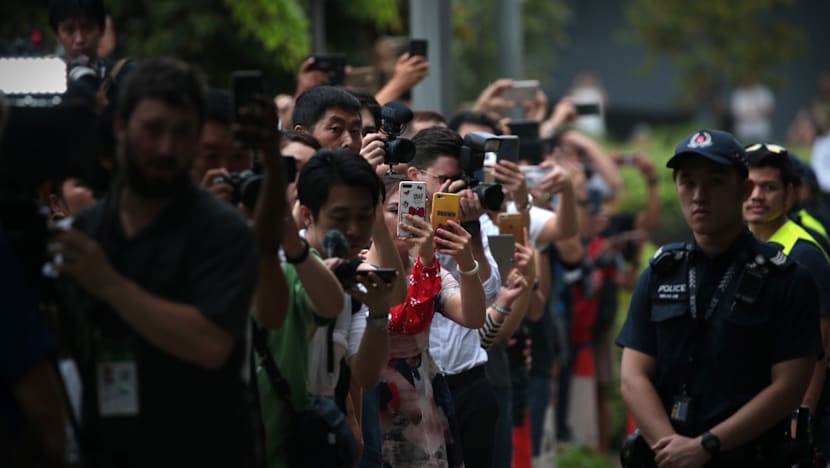 Curious onlookers hanging around entrance to Sentosa for glimpse of historic Trump-Kim summit