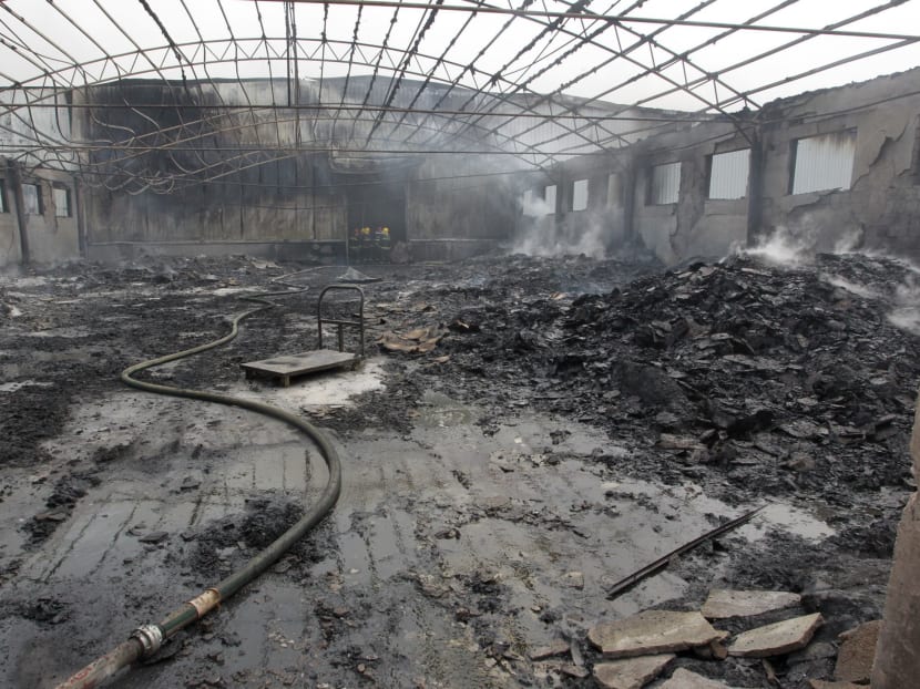 Gallery: China farm fire: Relatives scuffle with police, demand answers