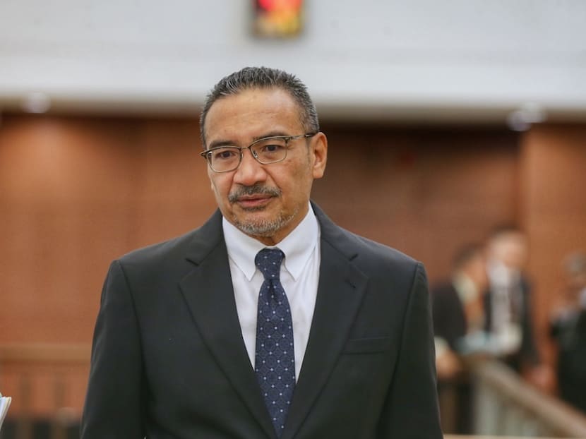 In the video, Mr Hishammuddin Hussein was seen vaping under his face mask while seated behind transport minister Wee Ka Siong, who was speaking.