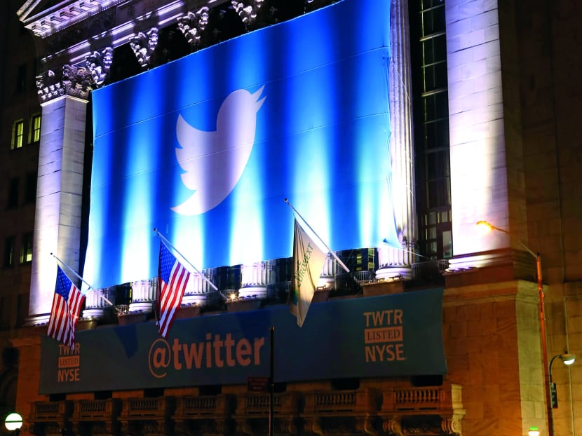 A banner adorns the facade of the New York Stock Exchange in advance of Twiiter’s initial public offering Thursday, Nov. 7, 2013, in New York. Twitter shares, valued at $26 per share, are set to begin trading on the stock exchange Thursday. The company is valued at $18.1 billion. (AP Photo/Kathy Willens)