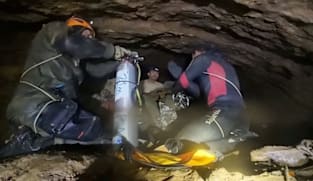 Rescuers seek new route to two missing in Laos cave