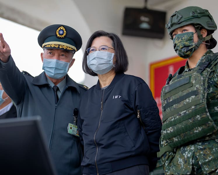 Taiwan's Tsai visits base as China protests US ship passage