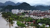 Typhoon Dolphin's vast storm system pushes inland, threatens central China