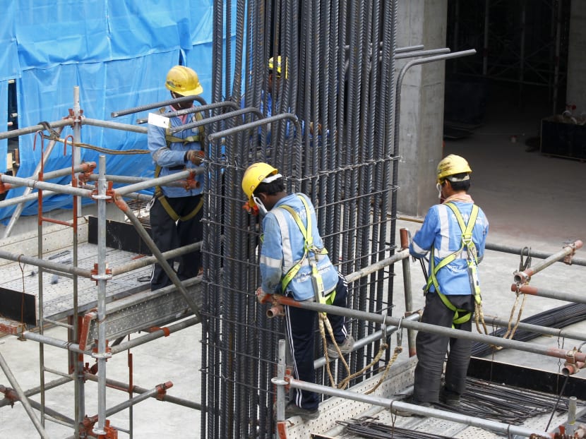 Workers at a construction site. TODAY File Photo