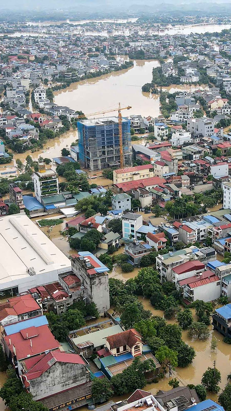 Record flooding hits Vietnam city, eight killed in the north