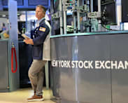 Global stocks mixed as yen falls despite Bank of Japan rate hike  