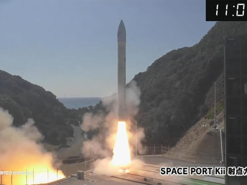 This frame grab taken from AFPTV via online footage broadcast by Wakayama Telecasting Corp on March 13, 2024 shows a small rocket being launched by Tokyo-based startup Space One, at the Spaceport Kii site in Kushimoto, Wakayama prefecture. 