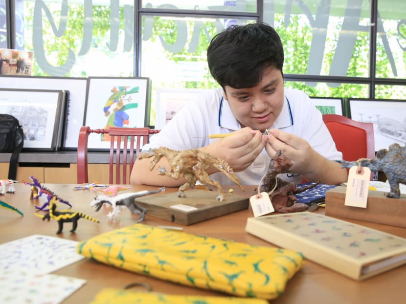 Dinosaurs a fascination for 19-year-old who designed Ho Ching’s pouch