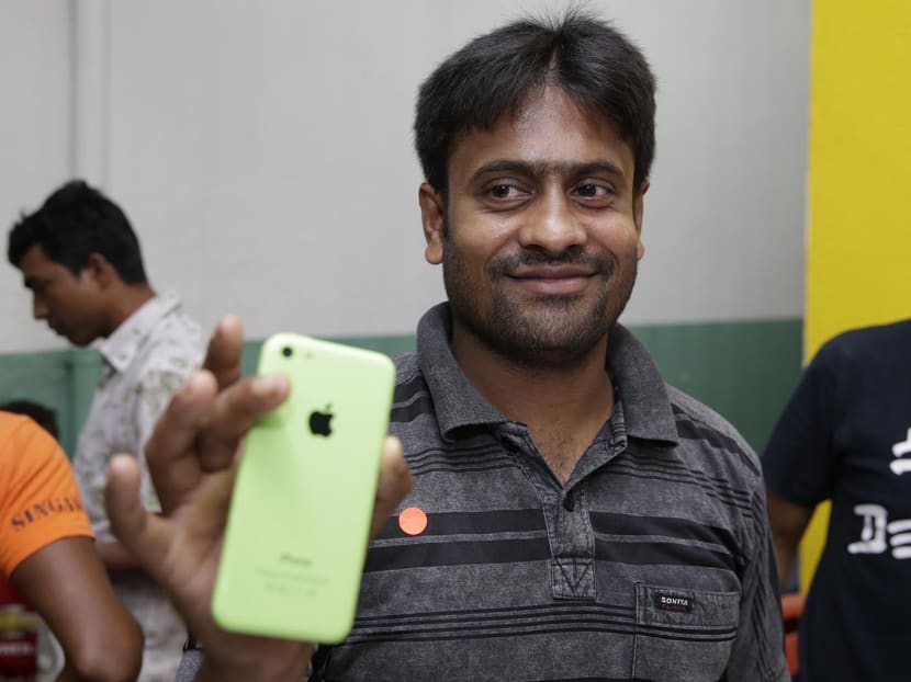 450 needy foreign workers set to get new phones ahead of 3G shift