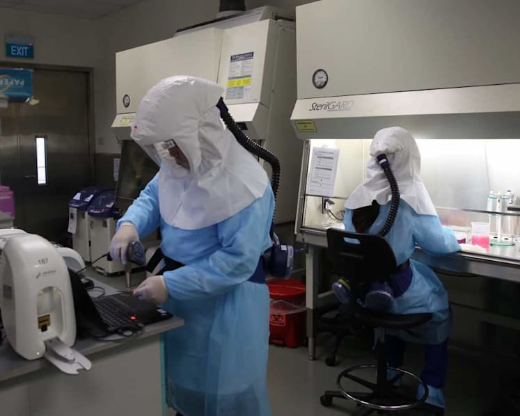 Explainer: What happens when a traveller is required to take a Covid-19 swab test at a Singapore checkpoint?