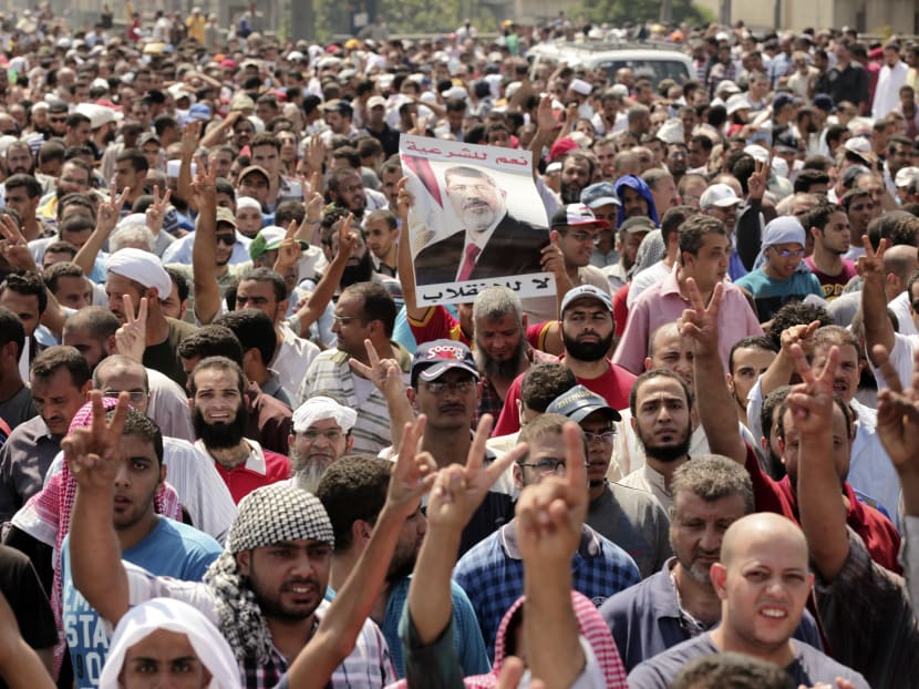 Supporters of ousted Egyptian President Mohammed Morsi march towards downtown Cairo from the Mohandeseen neighborhood of Cairo, Egypt, Friday, Aug, 16, 2013. Photo: AP