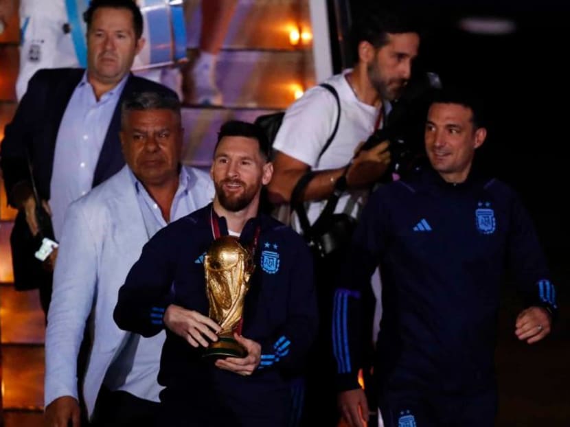 Argentine captain Lionel Messi with the World Cup trophy during the team's arrival at Ezeiza International Airport at Buenos Aires, Argentina.