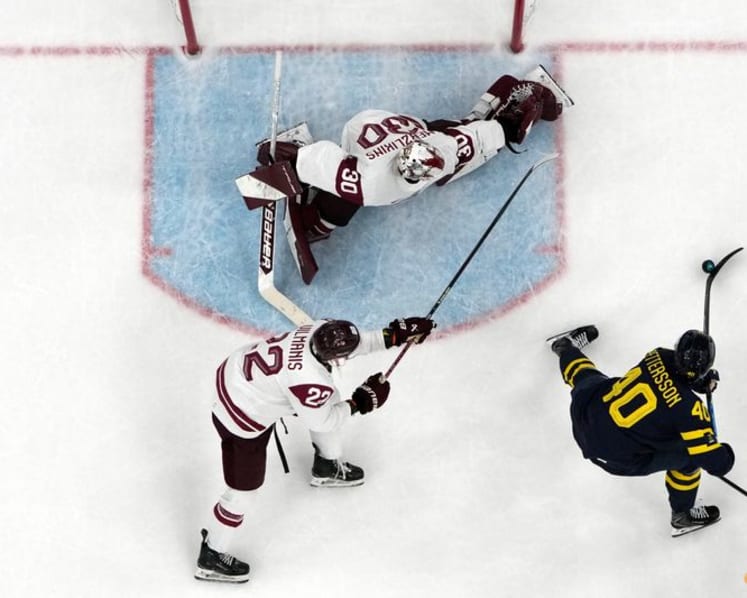 Ice hockey-Sweden beat Latvia to set men's quarter-final meeting with US