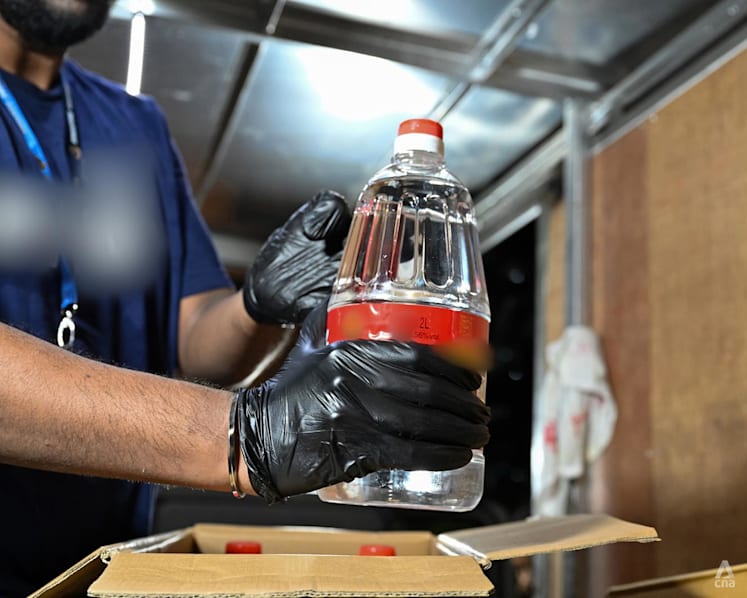 4 people arrested; 257 bottles of contraband liquor, 2 distillery machines seized in Singapore Customs raids
