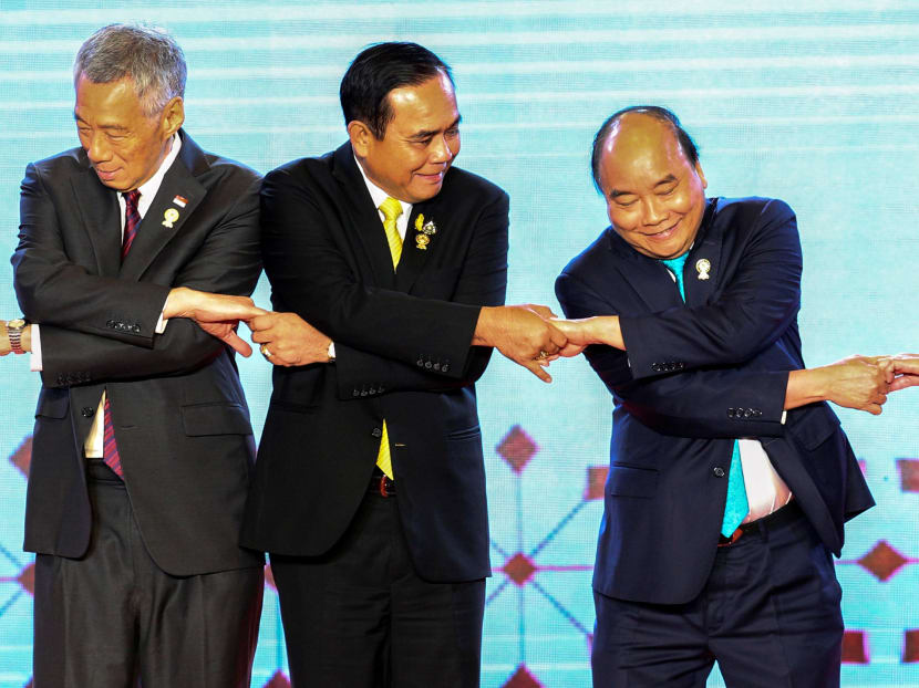 (From left) Singapore's Prime Minister Lee Hsien Loong, Thai Prime Minister Prayuth Chan-ocha and Vietnam's Prime Minister Nguyen Xuan Phuc shake hands on stage during the opening ceremony of the 34th Asean Summit at the Athenee Hotel in Bangkok, Thailand, June 23, 2019. (From left) Singapore's Prime Minister Lee Hsien Loong, Thai Prime Minister Prayuth Chan-ocha and Vietnam's Prime Minister Nguyen Xuan Phuc shake hands on stage during the opening ceremony of the 34th Asean Summit at the Athenee Hotel in Bangkok, Thailand, June 23, 2019.