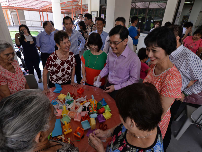Right to left: Ms Joan Pereira, Henderson-Dawson Grassroots Adviser, Finance Minister Heng Swee Keat and Dr Amy Khor, senior minister of state for Environment and Water Resources & Health, greeting elderly residents of Bukit Merah View at the Thong Kheng Senior Activity Centre on March 30, 2016. Photo: Robin Choo/TODAY Right to left: Ms Joan Pereira, Henderson-Dawson Grassroots Adviser, Finance Minister Heng Swee Keat and Dr Amy Khor, senior minister of state for Environment and Water Resources & Health, greeting elderly residents of Bukit Merah View at the Thong Kheng Senior Activity Centre on March 30, 2016. Photo: Robin Choo/TODAY