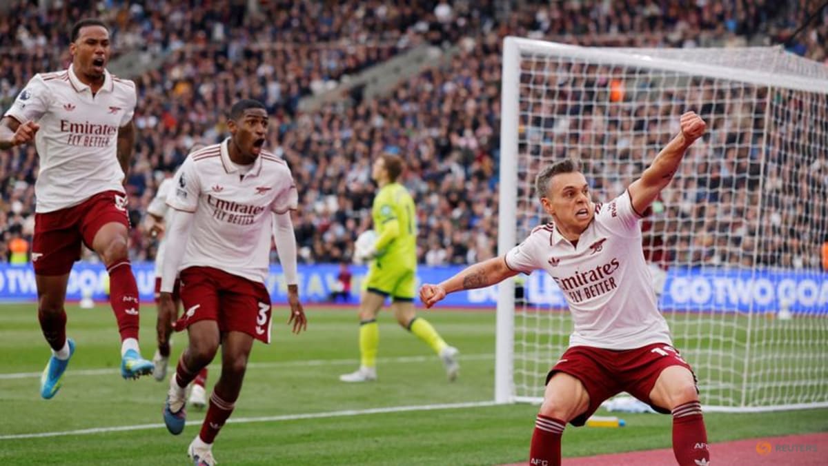 Arsenal survive huge scare to edge towards title