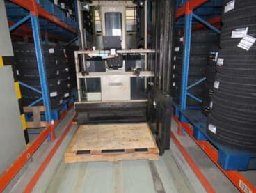 Goh Boon Yoke used a very narrow aisle machine (pictured) to lift Tay Hock Soon to reach storage racks at a height.
