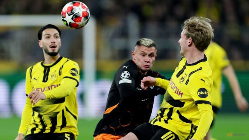 Dortmund beat Shakhtar Donetsk 3-1 to reach Champions League knockout play-offs Dortmund beat Shakhtar Donetsk 3-1 to reach Champions League knockout play-offs