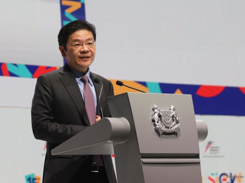 FILE PHOTO: Singapore's Deputy Prime Minister and Minister for Finance Lawrence Wong delivers the Singapore Energy Lecture during the 15th Singapore International Energy Week, in Singapore October 25, 2022. REUTERS/Isabel Kua