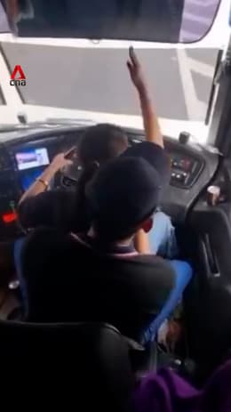 Bus driver in Malaysia sacked after driving with woman on lap