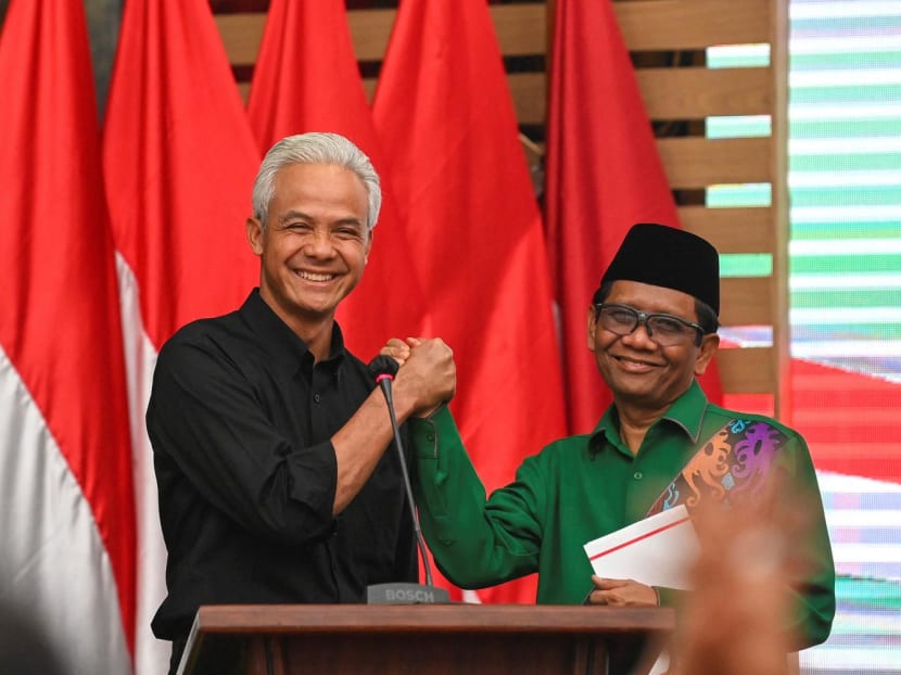 Mr Ganjar Pranowo (left), presidential candidate of the ruling Indonesian Democratic Party-Struggle (PDI-P), poses for photographs with his running mate, Mr Mohammad Mahfud Mahmodin (right), known as Mr Mahfud MD, during their declaration in Jakarta, Indonesia on Oct 18, 2023. Mr Ganjar Pranowo (left), presidential candidate of the ruling Indonesian Democratic Party-Struggle (PDI-P), poses for photographs with his running mate, Mr Mohammad Mahfud Mahmodin (right), known as Mr Mahfud MD, during their declaration in Jakarta, Indonesia on Oct 18, 2023.