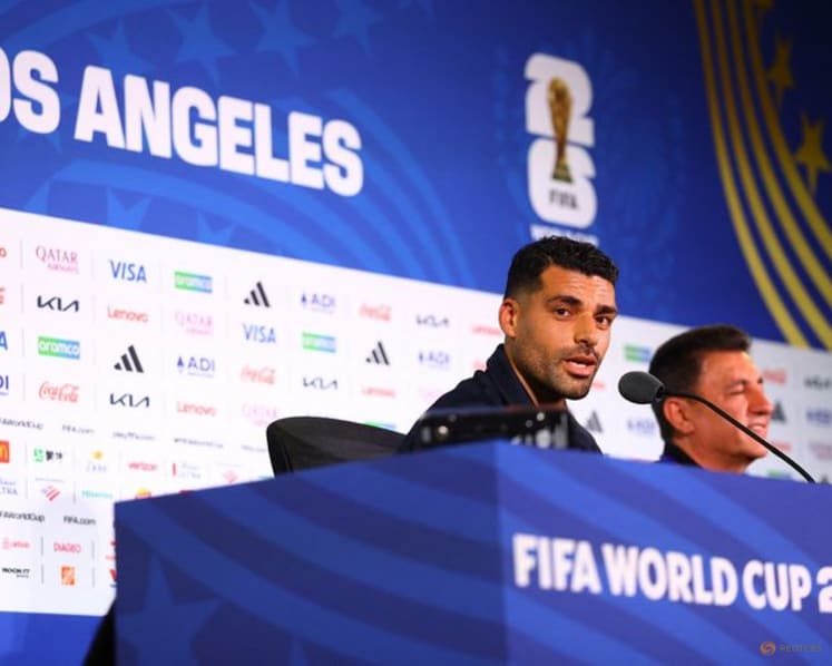 Iran's manager, striker pledge to play for all Iranians despite protests