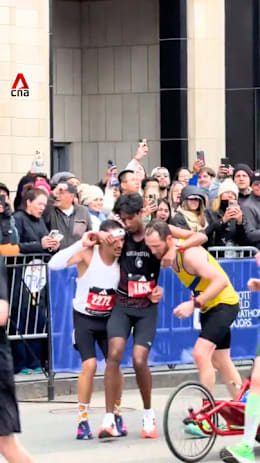 Boston marathon runners praised for giving up personal bests to help exhausted man finish