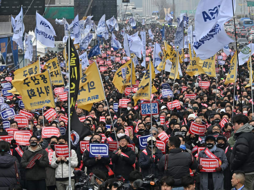 Doctors hold placards reading "Opposition to the increase in medical schools" during a rally against the government's plan to raise the annual enrolment quota at medical schools, in Seoul on March 3, 2024. Doctors hold placards reading "Opposition to the increase in medical schools" during a rally against the government's plan to raise the annual enrolment quota at medical schools, in Seoul on March 3, 2024.