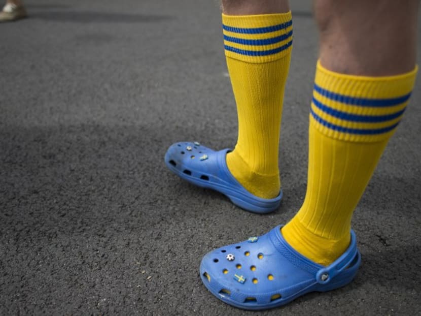 A pair of Crocs, worn with socks. Photo: AFP