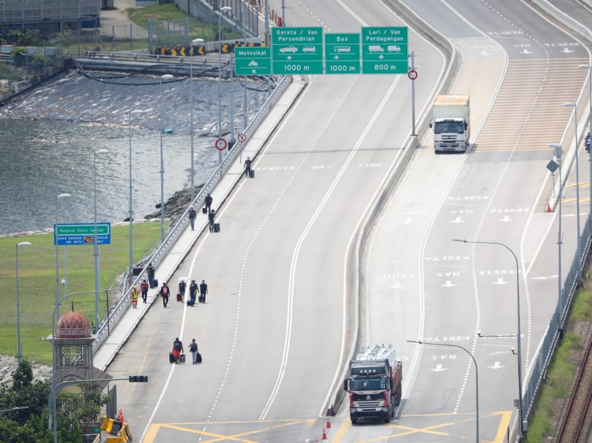 People seen crossing the Causeway on Aug 17, 2020. Johor’s chief minister Hasni Mohammad said that his state government would “continue to push Putrajaya to open up the border with Singapore as soon as possible”. People seen crossing the Causeway on Aug 17, 2020. Johor’s chief minister Hasni Mohammad said that his state government would “continue to push Putrajaya to open up the border with Singapore as soon as possible”.