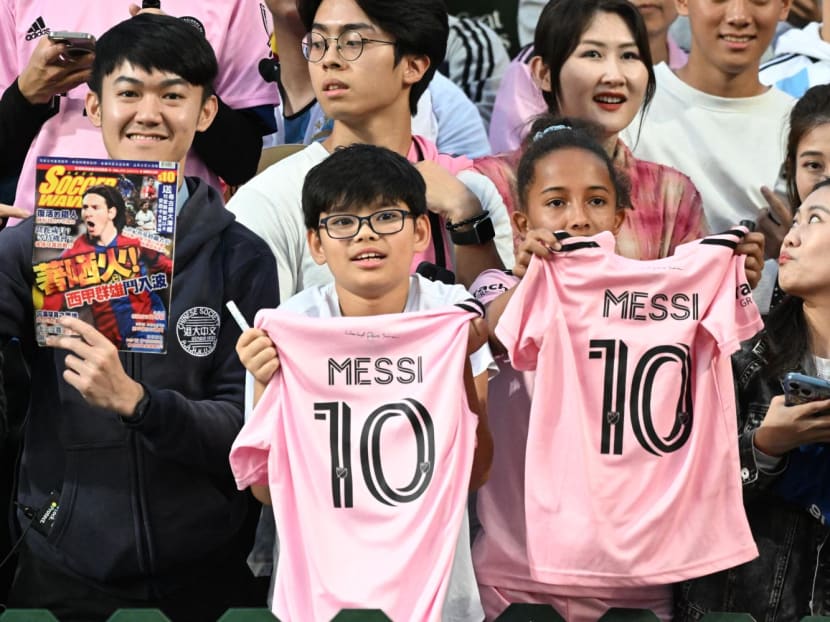 Fans cheer for Argentine forward Lionel Messi during training for the friendly football match between the Hong Kong team and Inter Miami at the Hong Kong Stadium on Feb 3, 2024.