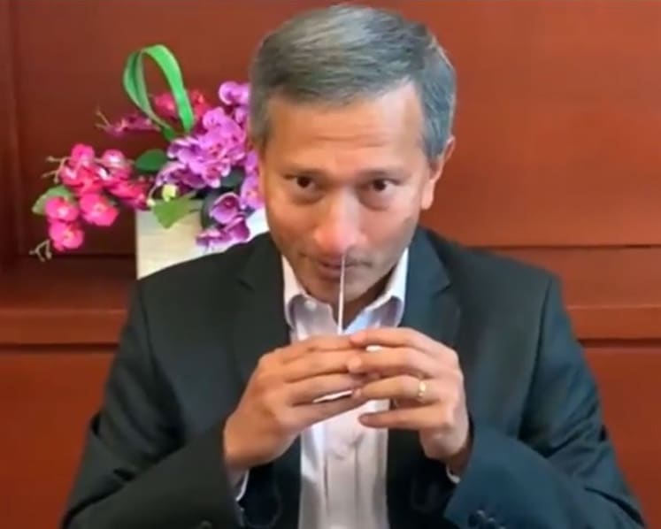 In a Facebook video, Vivian Balakrishnan demonstrates how quickly pre-event testing might be done