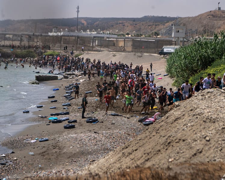 Hundreds of migrants flood into Spain's Ceuta exclave from Morocco