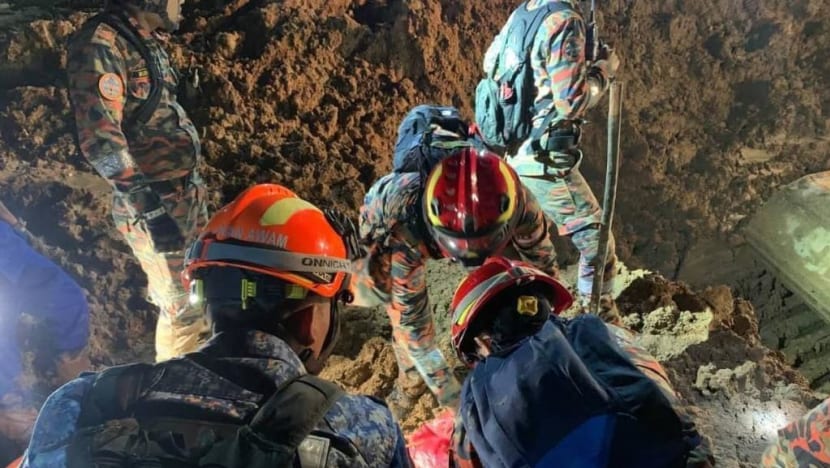 Body of man hugging dog recovered as Malaysia landslide death toll rises to 26 Body of man hugging dog recovered as Malaysia landslide death toll rises to 26