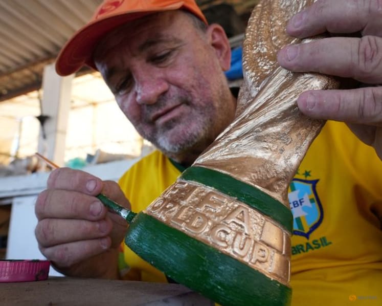 In Rio, artisan crafts World Cup trophies while hoping Brazil gets a real one