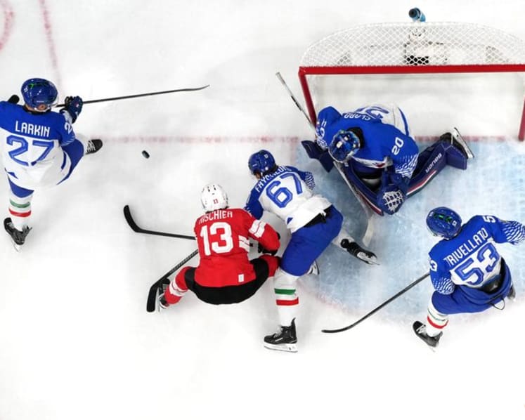 Ice hockey-Swiss ease past Italy to set up quarter-final with Finland
