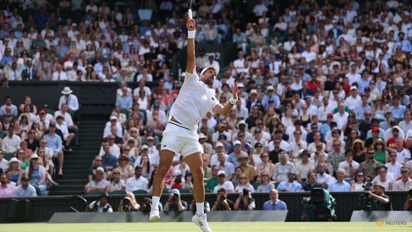 Djokovic moves past another Federer milestone to make Wimbledon quarter-finals