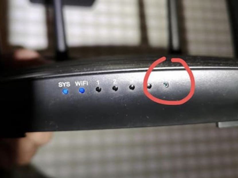 The woman examined the man’s router and realised it had been altered.