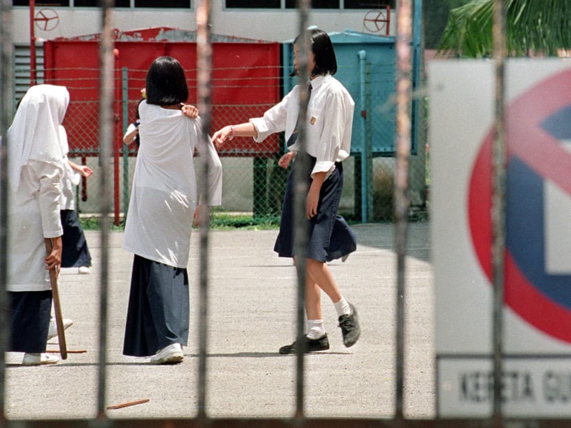 Young girls playing in a school yard in Malaysia. Photo: AFP