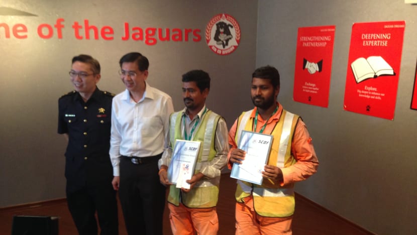 Duo lauded for rescuing toddler from second-storey ledge